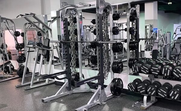free weight area, squat racks, dumbbells, no crowding