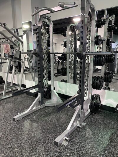 Roswell Fitness Factory free weight area. Open 24 hours, squat racks, dumbbells, kettlebells.